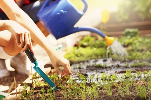 Gardener reviewing booking details for a garden service agreement